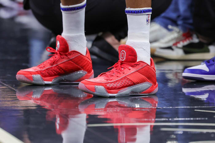 Minnesota Timberwolves guard Mike Conley's scarlet and grey Air Jordan sneakers.